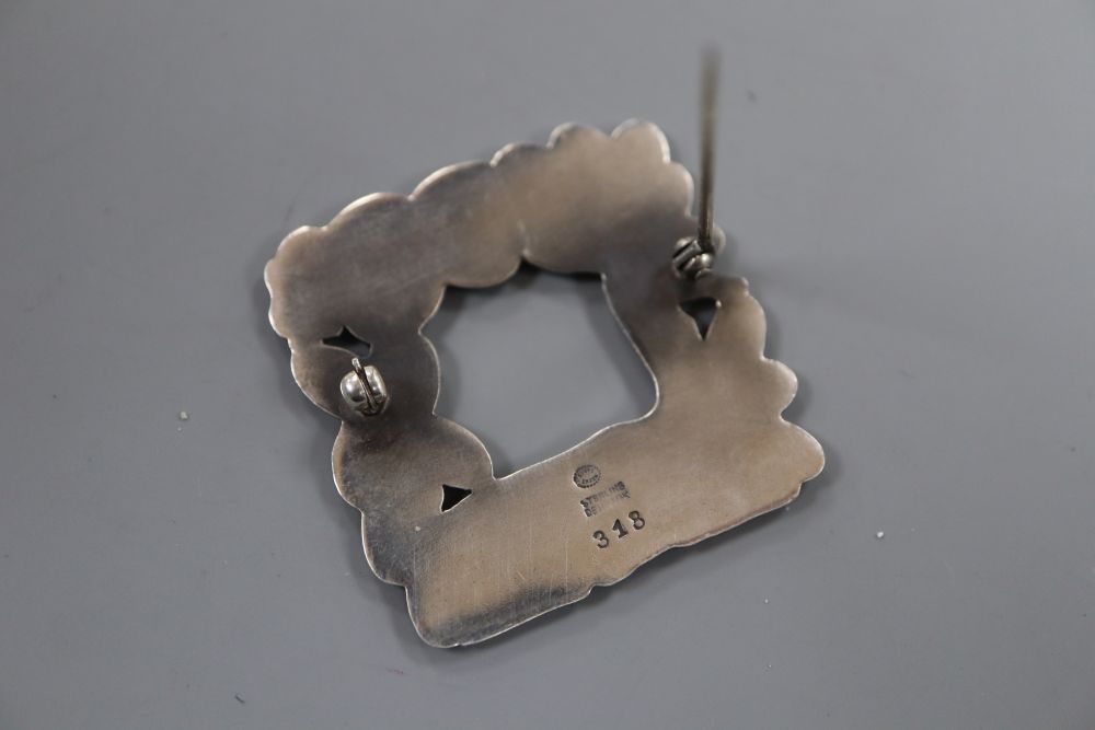 A post 1945 Georg Jensen recumbent deer and squirrel square brooch, design no. 318, 37mm, gross 15 grams.